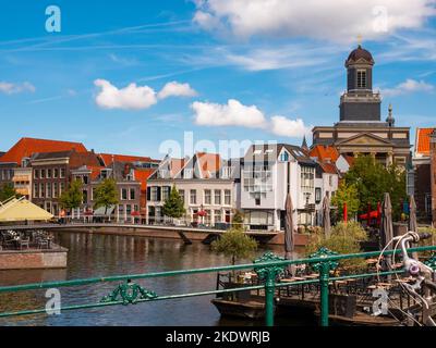 Summer view of Leiden cityscape with scenic canals, Netherlands Stock Photo