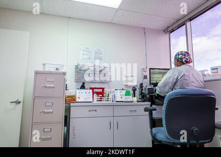 Miami Beach Florida,blood testing lab Black woman female technician employee employees worker workers working work workplace job jobs staff career car Stock Photo