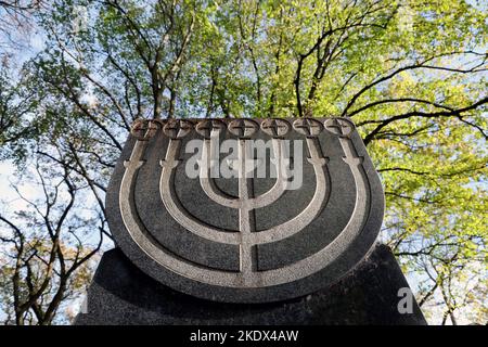 Rostock, Germany. 08th Nov, 2022. The seven-branched Menaro candelabra at the memorial site in the Jewish Cemetery. On 09.11.2022 the victims of the pogrom night of 09.11.1938 are commemorated nationwide. Credit: Bernd Wüstneck/dpa/Alamy Live News Stock Photo