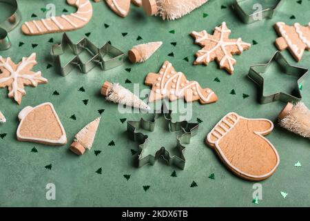 Composition with tasty Christmas cookies, cutters and decorations on color background Stock Photo