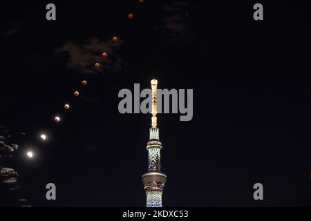 Tokyo, Japan. 8th Nov, 2022. This combo photo shows different stages of the moon during a total lunar eclipse and the Tokyo Sky Tree in Tokyo, Japan, on Nov. 8, 2022. Credit: Wu Min/Xinhua/Alamy Live News Stock Photo