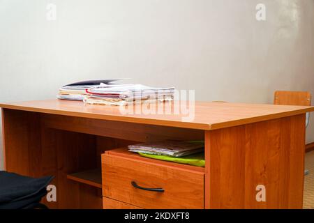 A stack of papers on a desktop without a computer Stock Photo