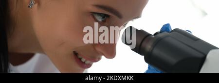 Pharmacy scientist working with professional microscope in technology lab Stock Photo