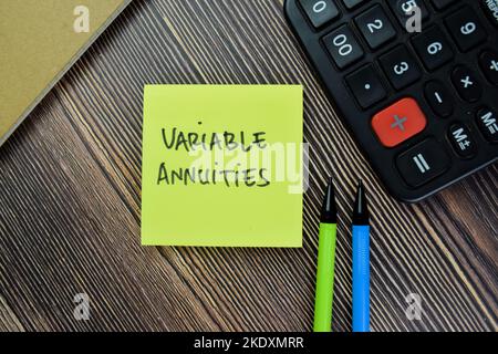 Concept of Variable Annuities write on sticky notes isolated on Wooden Table. Stock Photo