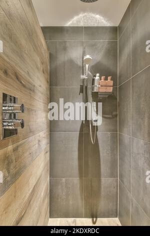 Interior of a modern shower with black walls Stock Photo