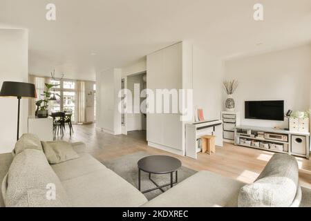 Modern interior of dining room with television by the wall Stock Photo