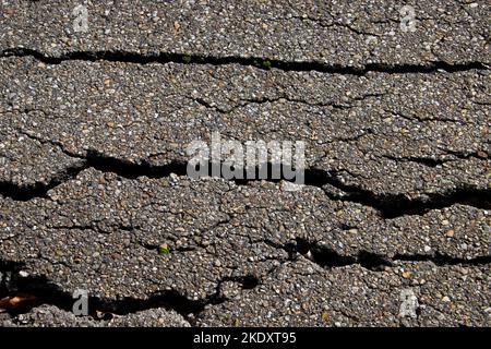 Crack in old worn asphalt road for background Stock Photo - Alamy