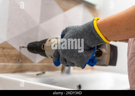 drilling holes in porcelain stoneware, drilling holes in tiles Stock Photo