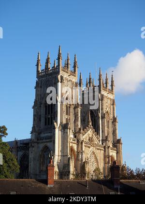 The historic Minster at York seen above the roofs of some terraced housing Stock Photo