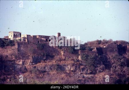 Ranthambore Fort lies within the Ranthambore National Park, near the city of Sawai Madhopur in Sawai Madhopur district of Rajasthan, India.The fort is characterised by temples, tanks, massive gates and huge walls. Stock Photo