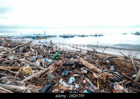 Garbage on beach, environmental pollution Bali island Indonesia. Tropical beach pollution Stock Photo
