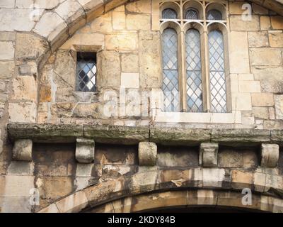 Details of the stonework and leaded windows of an mediaeval building Stock Photo
