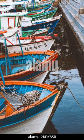 A vertical shot of boats parked at the dock on clear sky background in ...