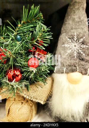 Elf and christmes tree Stock Photo