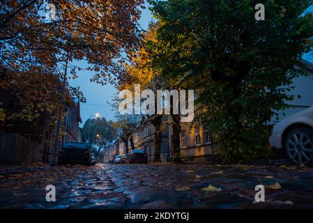 Liepaja city street in rainy autumn evening. Stock Photo