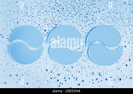 Three pair of blue hydrogel collagen eye patches on light background with drops. Beauty, cosmetics for skin care, lifting, wrinkle removal concept Stock Photo