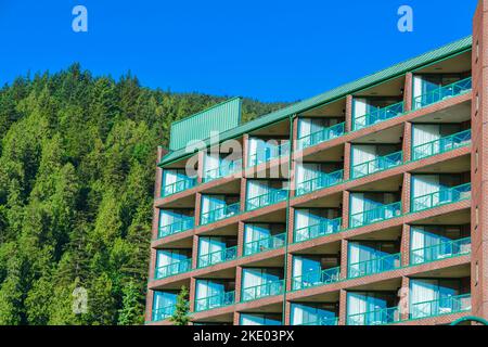 Resort building facade on mounting and blue sky background Stock Photo