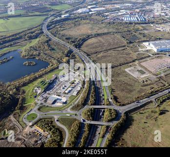 aerial view the M1 motorway near Leeds as it snakes away looking south from junction 45 at Skelton Lake Services Stock Photo