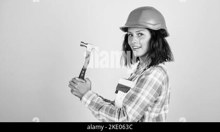 Creating perfection. professional manual worker. technician working using hammer tool. safety uniform. equipment for repairing. mechanic girl in Stock Photo