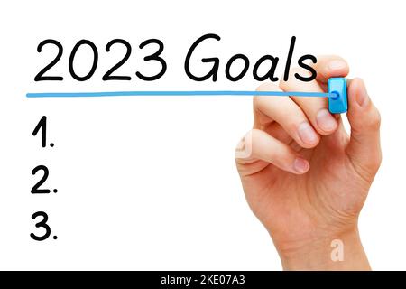 Hand writing blank goals resolutions list for the new year 2023 isolated on white background. Stock Photo