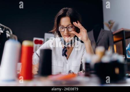 Designer working at tailor atelier Stock Photo