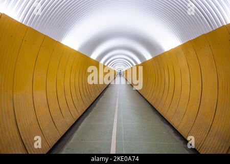 People in pedestrian Brunkenberg Tunnel in Stockholm, Sweden Stock Photo