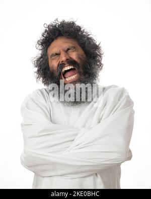 A crazy man expressing anger and discomfort in a straitjacket - the ...