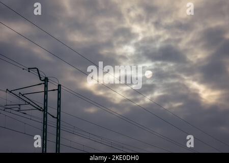 Traction poles next to railroad tracks in Rogow village in Lodzkie voivodeship of Poland Stock Photo