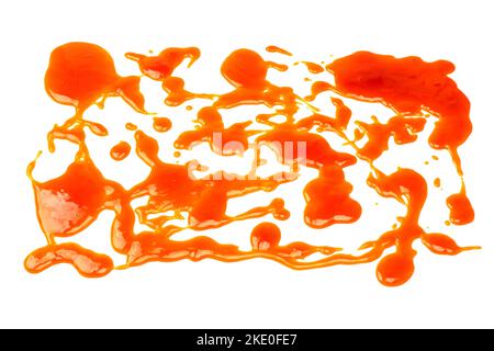 Orange sauce splashes isolated on white a background. Top view. Stock Photo