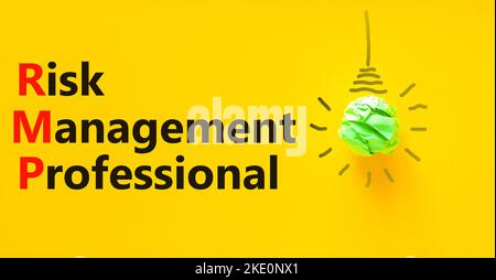 RMP risk management professional symbol. Concept words RMP risk management professional on a beautiful yellow background. Light bulb. Business RMP ris Stock Photo