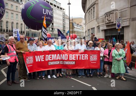 Participants gather and march during ‘We demand better’ demonstration called by the TUC amid the rising cost of living in London. Stock Photo