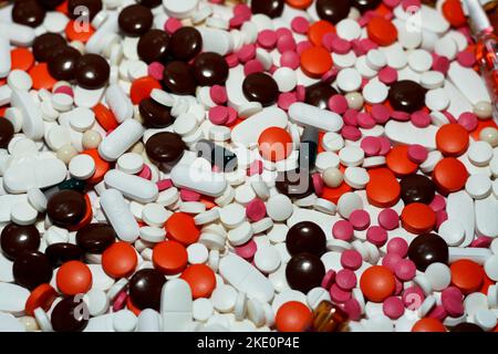 Cairo, Egypt, October 29 2022: pile of different medical tablets, pills, capsules and ampules that used to treat various diseases and conditions, stac Stock Photo