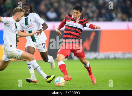 NO SALES IN JAPAN! left to right Marvin FRIEDRICH (MG), Kouadio KONE (MG), Wataru ENDO (S) duels, action, soccer 1st Bundesliga, 13th matchday, Borussia Monchengladbach (MG) - VfB Stuttgart (S) 3:1, on 04.11 .2022 in Borussia Monchengladbach/ Germany. #DFL regulations prohibit any use of photographs as image sequences and/or quasi-video # NO SALES IN JAPAN! Stock Photo