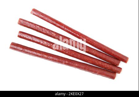 Group of small smoked sausages isolated on white. Stock Photo