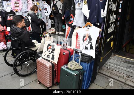 Disabled man in front of a clothes shop -  London - England Stock Photo