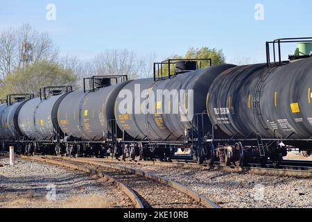 Griffith, Indiana, USA. A unit freight train made up of tank cars passing through a diamond crossing of two Canadian National Railway subdivisions. Stock Photo