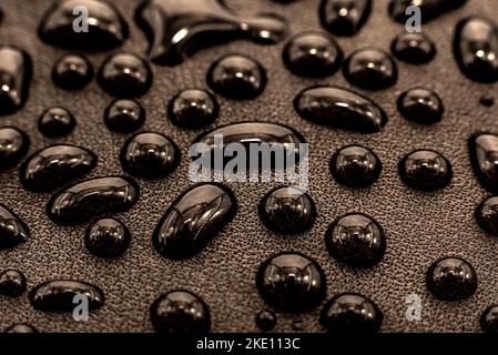 Drops of water on textiles. Waterproof fabric with drops on the surface Stock Photo