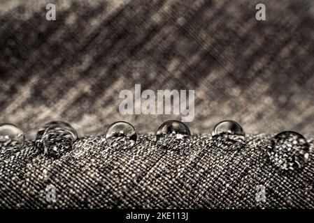 Drops of water on textiles. Waterproof fabric with drops on the surface Stock Photo