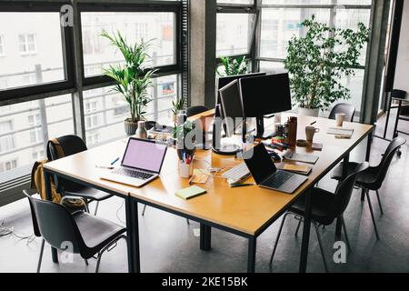 Laptop and computer on desk at office Stock Photo