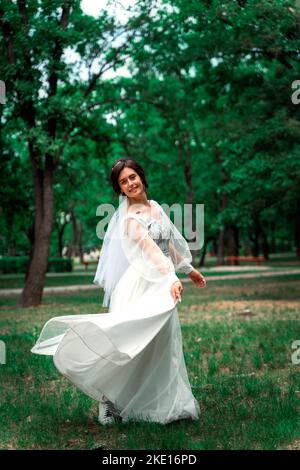 bride dancing in a dress Stock Photo