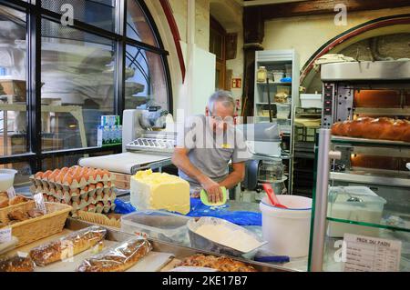 SELESTAT, FRANCE - DECEMBER 20, 2015: Bakers preparing dough for Christmas pastries at Bread house (La Maison du Pain). Stock Photo