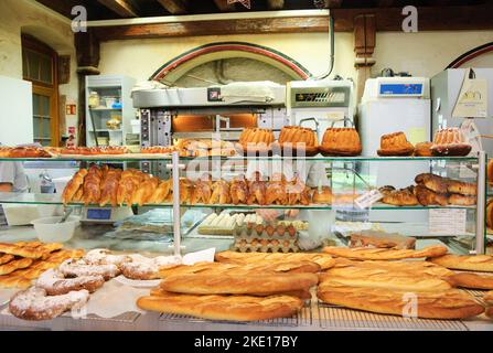 SELESTAT, FRANCE - DECEMBER 20, 2015: Bakers preparing dough for Christmas pastries at Bread house (La Maison du Pain). Stock Photo