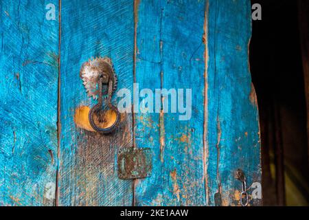 Old door handle on wooden door in Berber village , Atlas mountains, Morocco Stock Photo