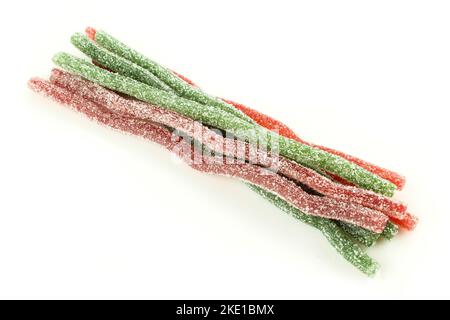Group of red end green chewy worms isolated on white background. Sugar coated sour candies for kids Stock Photo