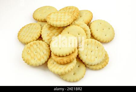 Pile of salty round crackers isolated on white background Stock Photo