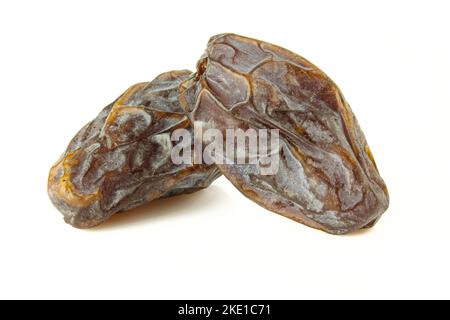 Two medjool dates isolated on white background Stock Photo