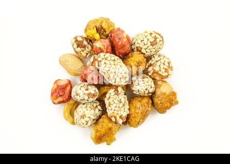 Mix of glazed candied peanuts with honey and sesame seeds isolated on white background Stock Photo