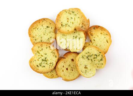 Pile of spiced bruschette chips isolated on white background Stock Photo