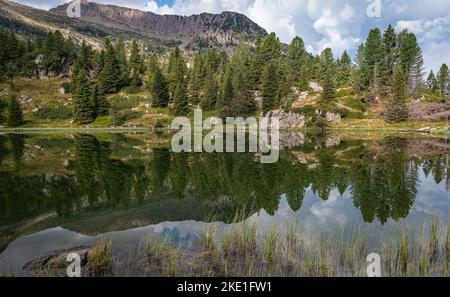 the Colbricon lakes in summer with the mountain reflected on the water - Lagorai chain, Trento province,Trentino Alto Adige, northern Italy - Europe - Stock Photo