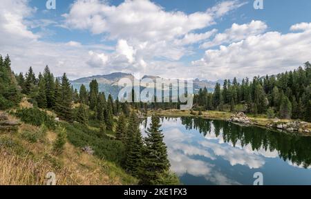 the Colbricon lakes in summer with the mountain reflected on the water - Lagorai chain, Trento province,Trentino Alto Adige, northern Italy - Europe - Stock Photo